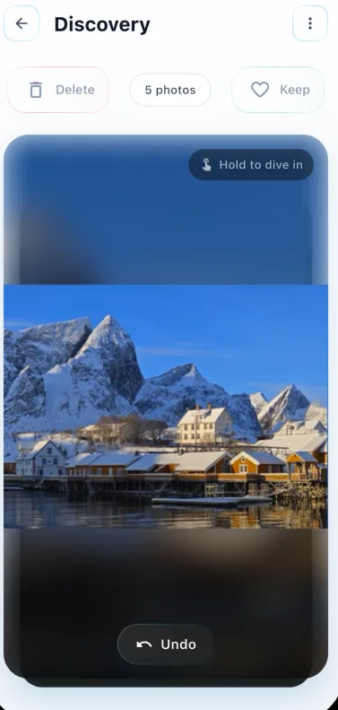 The current SwipeLah Discovery screen displaying the snowy February village photo with Delete, Keep, and Undo controls.